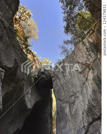 Majestic rock formations under a clear blue sky showcasing nature's beauty and grandeur in a canyon landscape concept Majestic rock formations under a clear blue sky showcasing nature's beauty and grandeur in a canyon landscape concept 124379831