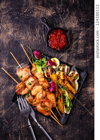 Chicken skewers kebab with vegetables 124380113