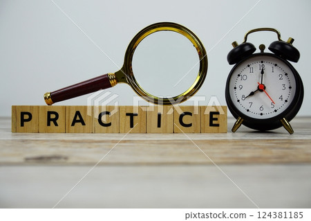 Time to Practice with wooden blocks alphabet letters and Magnifying glass on wooden background Time to Practice with wooden blocks alphabet letters and Magnifying glass on wooden background 124381185