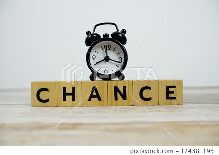 Time to Chance with wooden blocks alphabet letters and alarm clock on wooden background Time to Chance with wooden blocks alphabet letters and alarm clock on wooden background 124381193