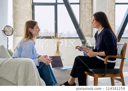 Young woman patient during therapy session in professional mental therapist's office 124381259