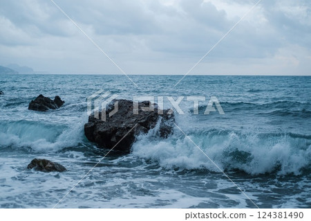 Ocean Waves Crashing Against Coastal Rock Ocean Waves Crashing Against Coastal Rock 124381490