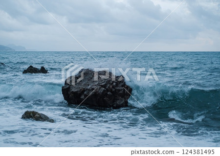 Ocean Waves Crashing Against Coastal Rock Ocean Waves Crashing Against Coastal Rock 124381495