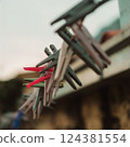 Vintage wooden Clothes Pegs Hanging on a Line 124381554