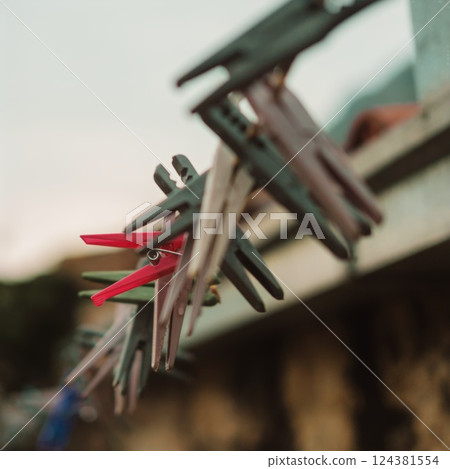 Vintage wooden Clothes Pegs Hanging on a Line Vintage wooden Clothes Pegs Hanging on a Line 124381554