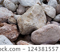 Pile of Large Weathered pink Rocks and Boulders  124381557
