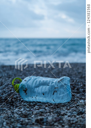 Plastic Bottle and Waste Polluting a Beach Plastic Bottle and Waste Polluting a Beach 124381568