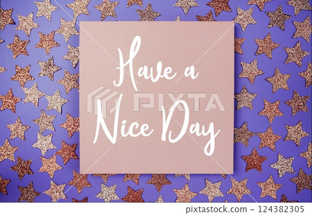 Have a Nice Day text on paper card with star glitter decoration flat lay on purple background Have a Nice Day text on paper card with star glitter decoration flat lay on purple background 124382305