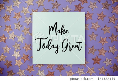 Make Today Great text motivational and inspiration quote on paper card with star glitter decoration flat lay on purple background Make Today Great text motivational and inspiration quote on paper card with star glitter decoration flat lay on purple background 124382315