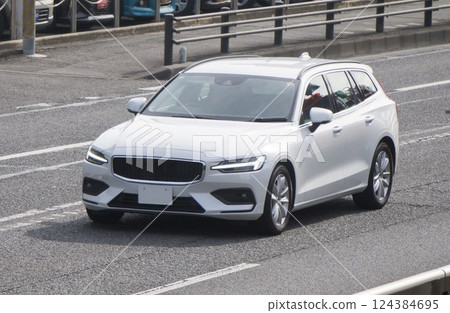 Compact car road driving Compact car road driving 124384695