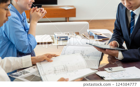 Housing sales meeting scene hands no face Housing sales meeting scene hands no face 124384777