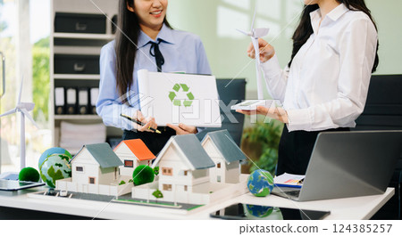 Business team people planning hand using laptop for working technology and business Net zero 124385257