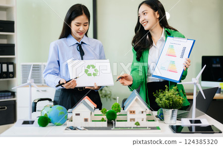Business team people planning hand using laptop for working technology and business Net zero 124385320