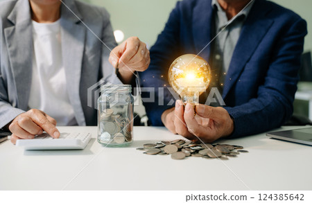 business team hand showing creative business strategy with light bulb 124385642