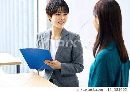 Two businesswomen having a meeting in an office. Photo courtesy of Sky Perfect Tokyo Media Center. 124385665