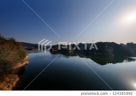 Wind blowing across the lake surface - Spring 2025 at Nara Nunome Dam - Spring hazy sky 124385892