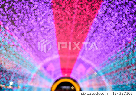 Colored decorative festive bokeh lights sparkle brightly. 124387105