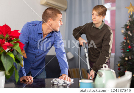 Man and his son communication during housekeeping before New Year 124387849