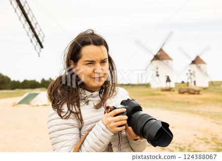 Tourist taking photo, Mota del Cuervo, Spain 124388067