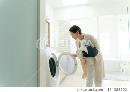 Woman doing the laundry 124388202