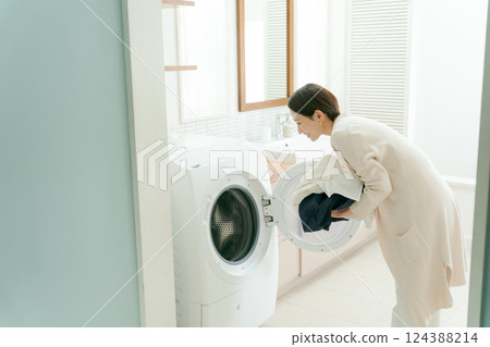 Woman doing the laundry 124388214