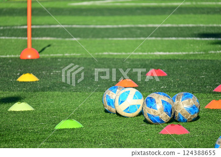 artificial green grass soccer field with training cone and ball 124388655