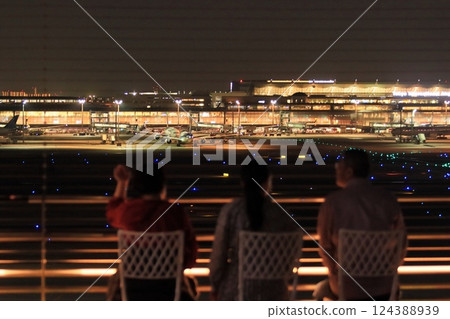 A family looking at the night view of Haneda Airport A family looking at the night view of Haneda Airport 124388939