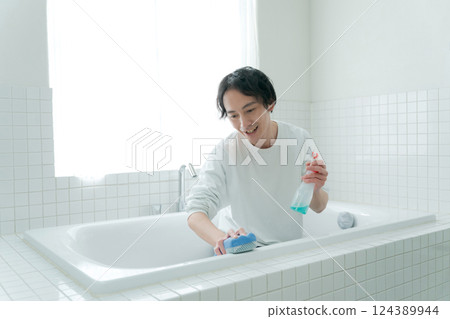 Men cleaning the bath Men cleaning the bath 124389944