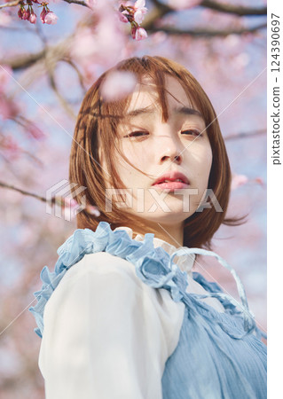 Cherry blossoms and a young woman Cherry blossoms and a young woman 124390697
