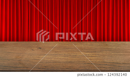 An empty wooden table is set against a red curtain background. An empty wooden table is set against a red curtain background. 124392140