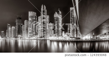 Skyscrapers and Urban city skyline over water, black and white style, city background, Dubai Marina bay UAE 124393048