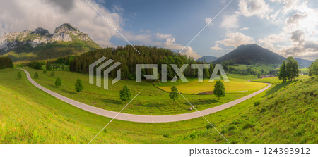 Meadow with road and bench during sunset in Berchtesgaden National Park Meadow with road and bench during sunset in Berchtesgaden National Park 124393912