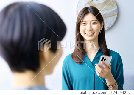 Two businesswomen having a meeting in an office. Photo courtesy of Sky Perfect Tokyo Media Center. 124394202