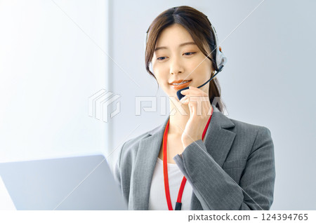 Female operator wearing an intercom Filming cooperation: SKY Perfect Tokyo Media Center 124394765