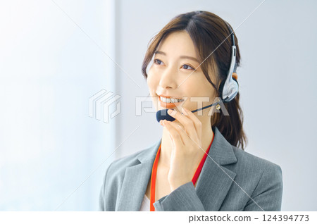 Female operator wearing an intercom Filming cooperation: SKY Perfect Tokyo Media Center Female operator wearing an intercom Filming cooperation: SKY Perfect Tokyo Media Center 124394773
