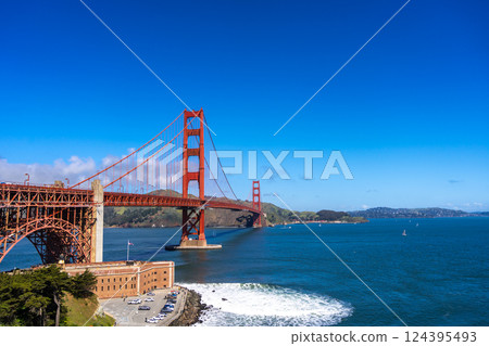 Golden Gate Bridge over blue waters with scenic hills in San Francisco 124395493