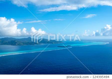 Aerial view of Tahaa island, French Polynesia, with turquoise lagoon and reef 124395494