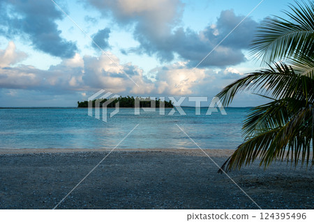 Sunset over a tropical motu on Tikehau Atoll, French Polynesia Sunset over a tropical motu on Tikehau Atoll, French Polynesia 124395496
