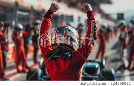 professional formula 1 racing driver pilot in red uniform and helmet celebrating victory, motorsport winner celebrate 124396982