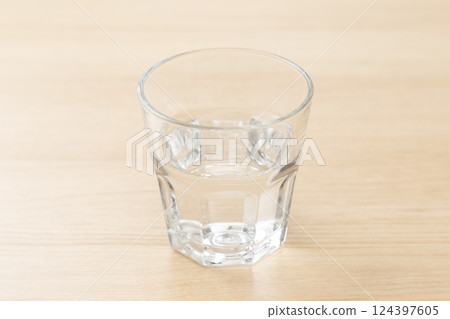 Glass of water on the table Glass of water on the table 124397605