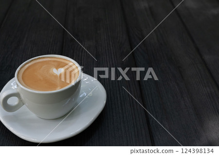 Hot coffee cup of latte art, coffee on wooden table in the morning. Copy space for your text Hot coffee cup of latte art, coffee on wooden table in the morning. Copy space for your text 124398134