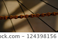 Rusty bicycle chain from a poorly maintained bicycle 124398156