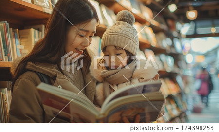 A mother and daughter enjoying storytime together in a cozy bookstore, fostering love for reading and bonding. 124398253