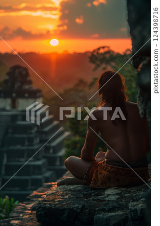 A serene moment capturing a person meditating at sunset, overlooking ancient ruins, symbolizing inner peace. 124398716