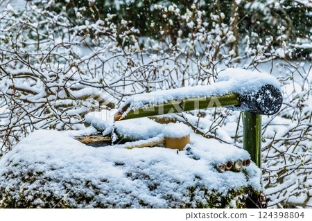 Snow-covered Hosen-in Temple in Ohara, Kyoto - Chozubachi (water basin) at Bankan-en 124398804