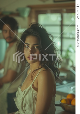 A candid moment of a woman in a cozy kitchen, exuding natural beauty and introspection. A candid moment of a woman in a cozy kitchen, exuding natural beauty and introspection. 124398812