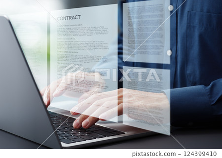 Writing a contract document. Close-up of hands typing on a laptop keyboard. Sue working at a desk in the office. 124399410