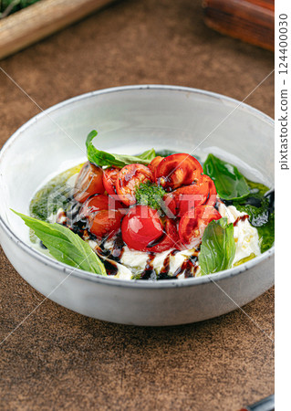 Gourmet appetizer with tomato and soft cheese 124400030