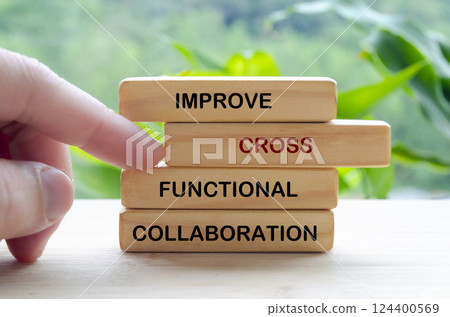 Improve Cross Functional Collaboration text on wooden blocks representing continuous improvement in business strategy Improve Cross Functional Collaboration text on wooden blocks representing continuous improvement in business strategy 124400569