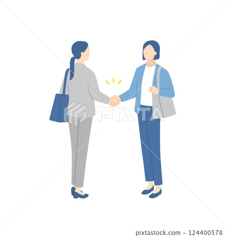 Businesswomen shaking hands while holding business bags 124400578